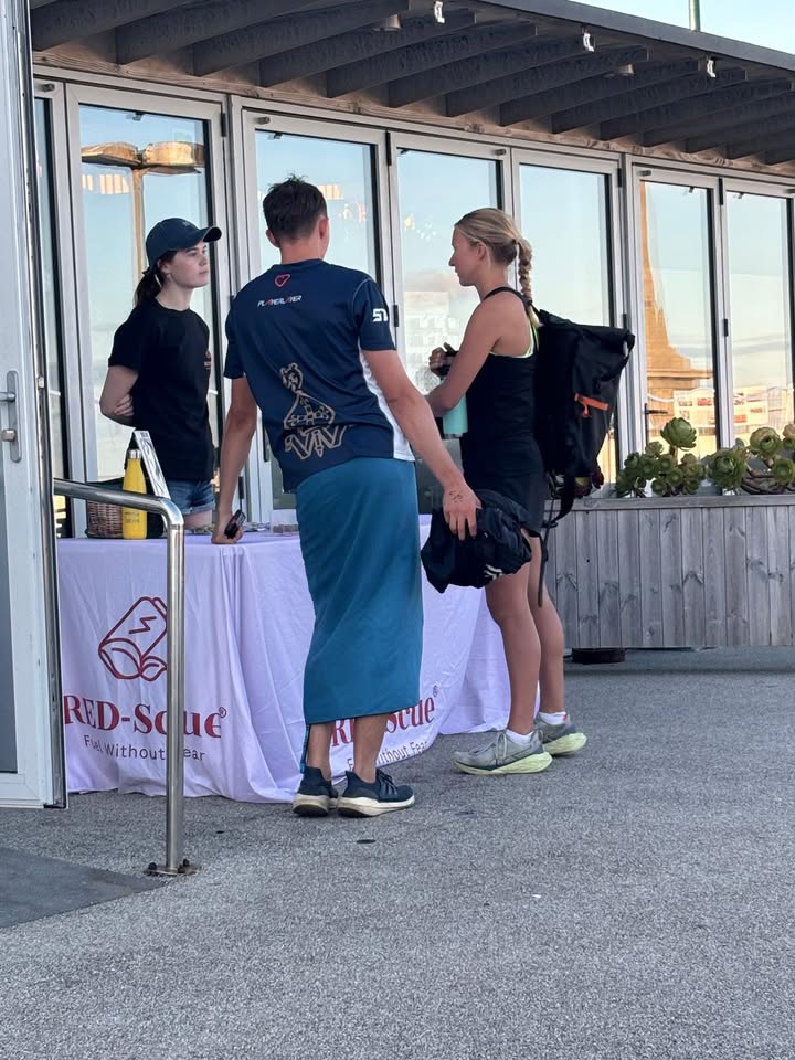 RED-Scue chatting with athletes at an event